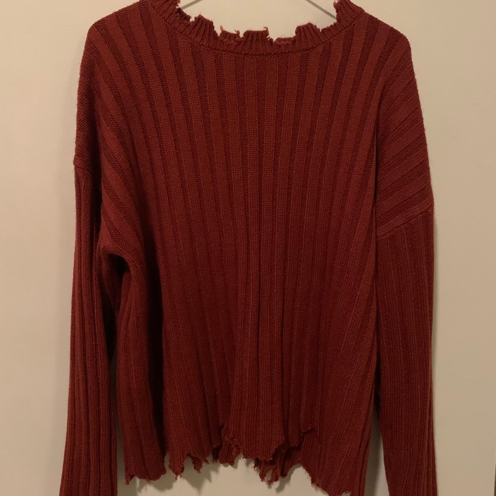 Over sized sweater with the “torn” look